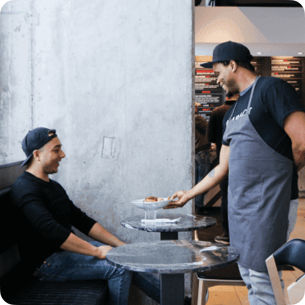Image of a client at restaurant getting his meal - 7shifts.com